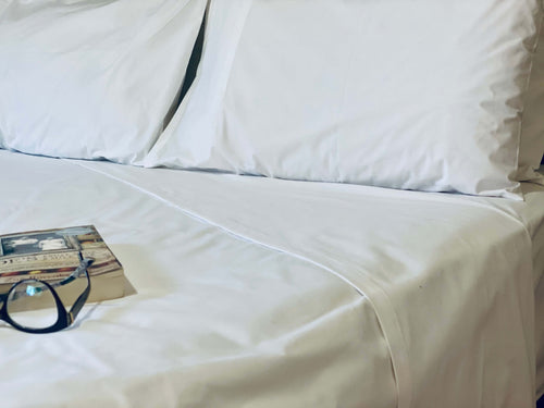 Product shot of My Hotel Linen's high quality classic white sheet set with pillowcases.